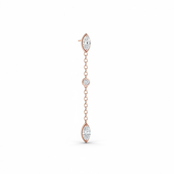 Rose gold earring with clear gemstones on a white background