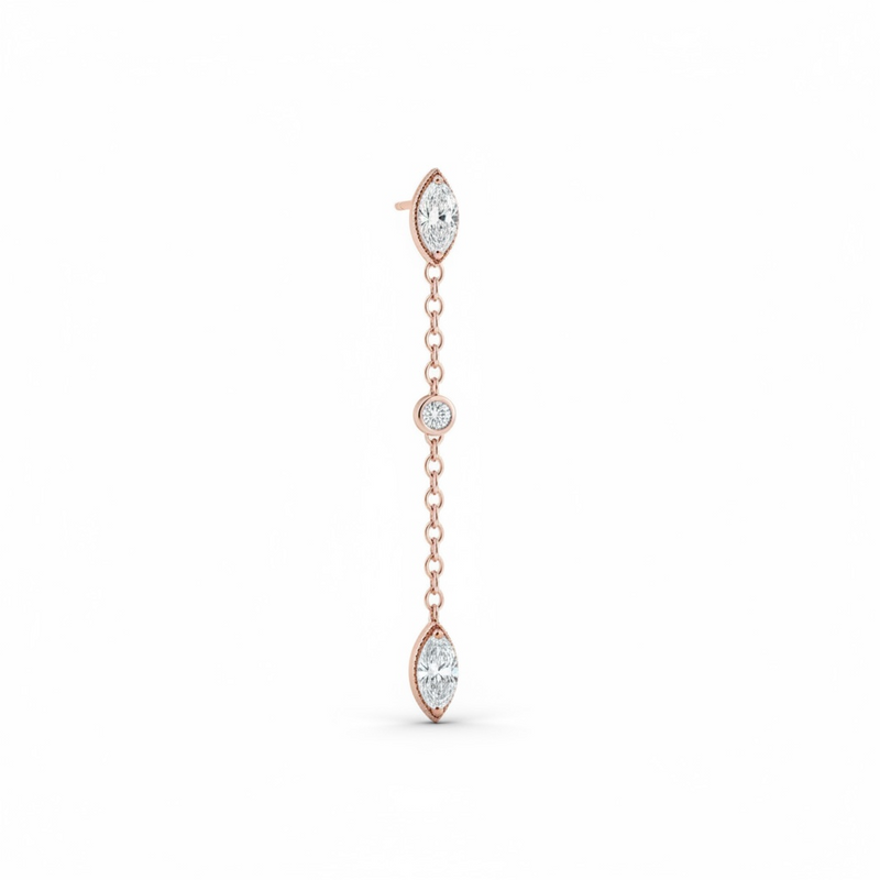 Rose gold earring with clear gemstones on a white background