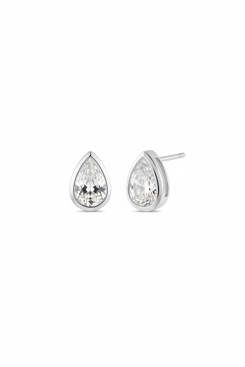 Teardrop-shaped gold earrings with clear diamond on a white background
