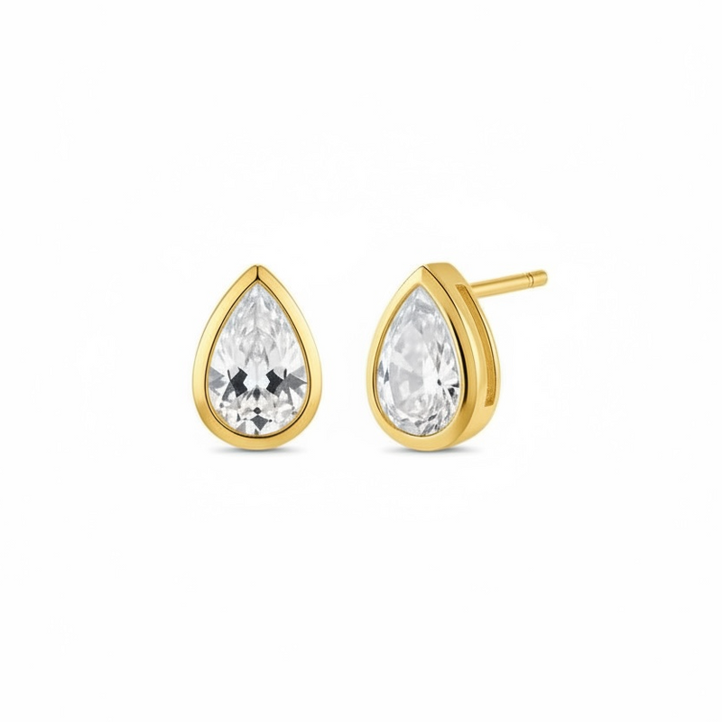 Gold teardrop earrings with clear diamond on a white background